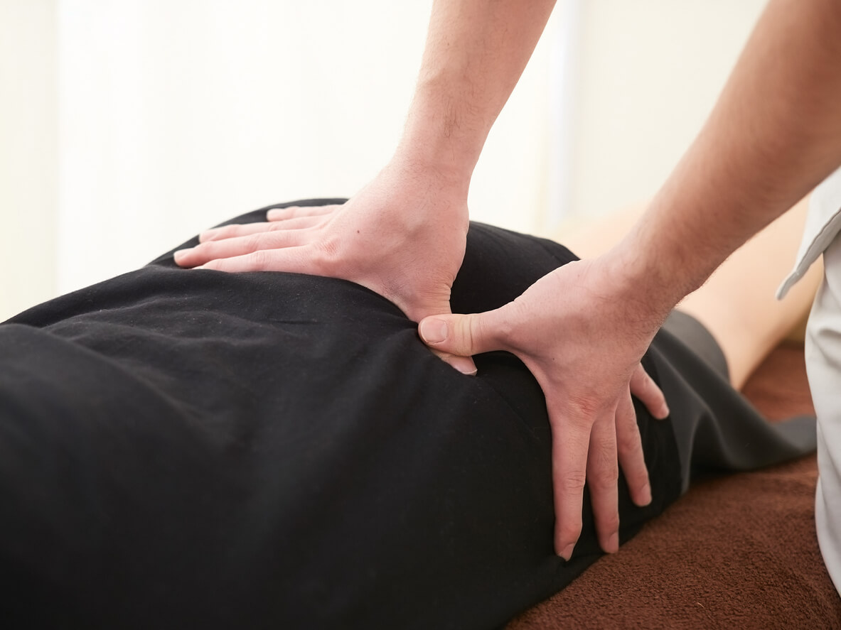 Nailsworth woman receiving chiropractic care from our chiropractors for Nailsworth